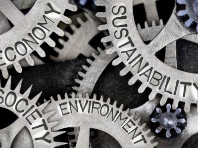 Economy, Sustainability, Environment, and Society written on gears