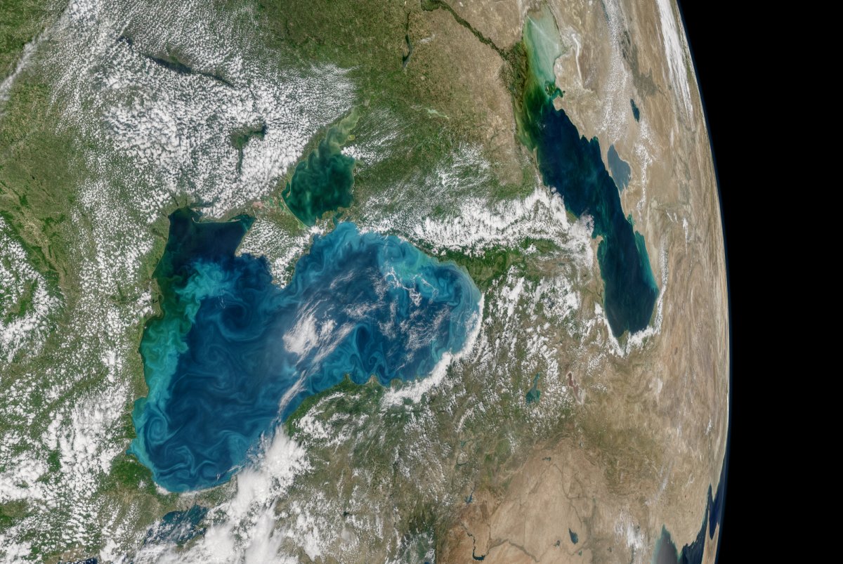 Earth from space, showing land masses, bodies of water, and clouds