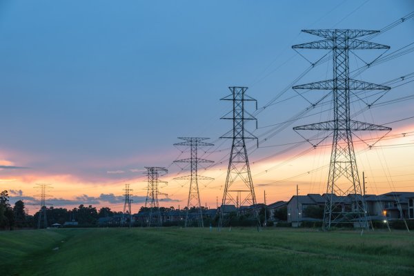 electrical transmission power lines at sunset