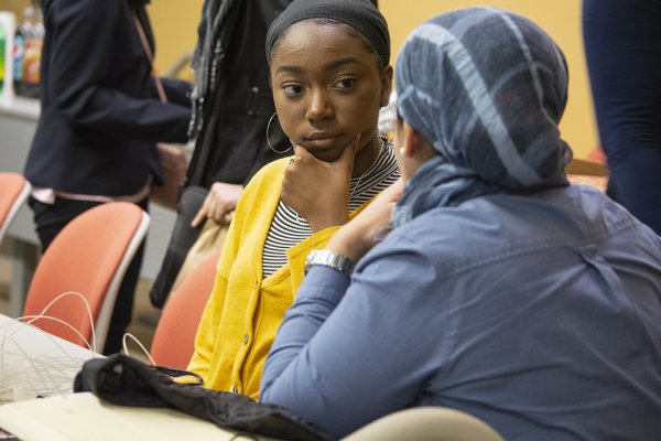 Faculty mentor Ola Rashwan, speaks with high school student Zimirah Wilson (left), at an EnvironMentors meeting in Harrisburg, Pennsylvania, early in the spring 2020 semester.