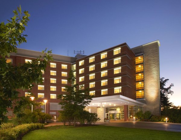 The Penn Stater Hotel and Conference Center is shown at dusk.