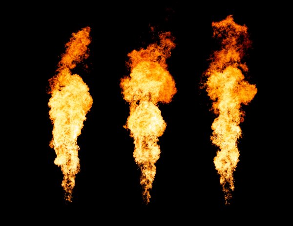 Set of three isolated fire pillars. Flame tongue goes from gas burner