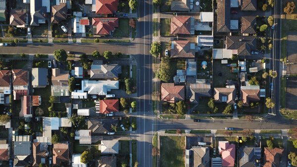 An aerial view of houses lining streets