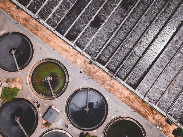 Top-down aerial view of a wastewater treatment plant