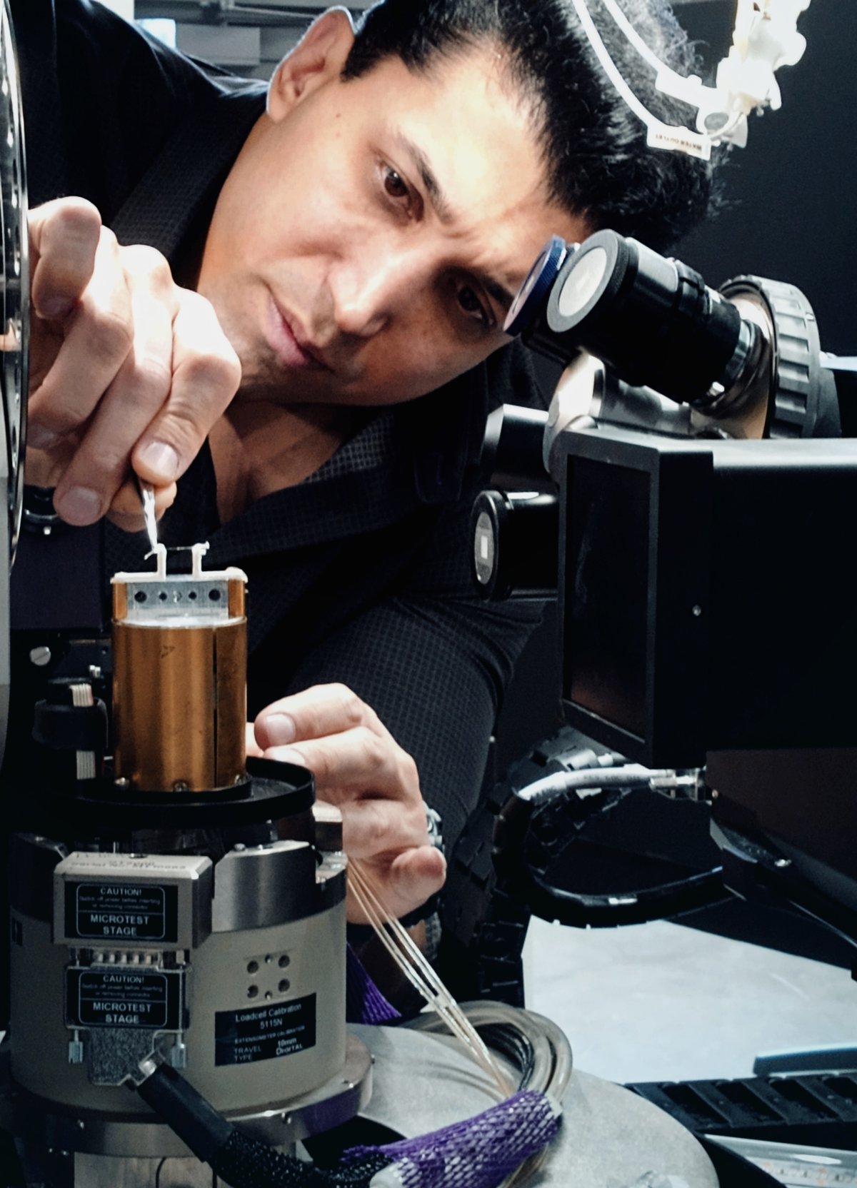 Fariborz Tavangarian places a spicule from a marine sponge sample into the Zeiss Versa 620. 