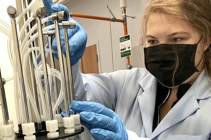  Olivia Mroczko, graduate student in agricultural and biological engineering, is evaporating filtered wastewater samples with a nitrogen gas generator in the Natural Resources Engineering Water Quality Laboratory in the Agricultural Engineering Building. She will then analyze the filtered water for pharmaceuticals.