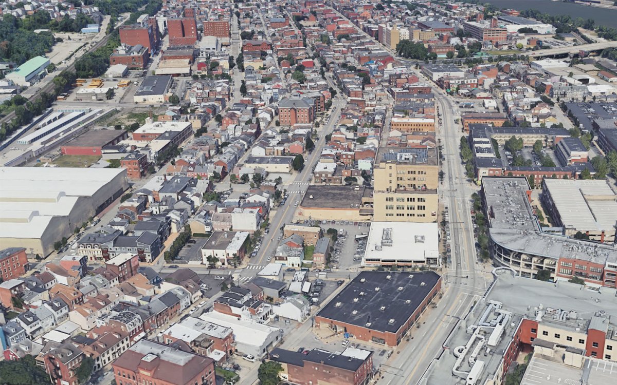 Aerial view of the South Side Flats neighborhood in Pittsburgh, showing dense buildings and pavement with very few trees.