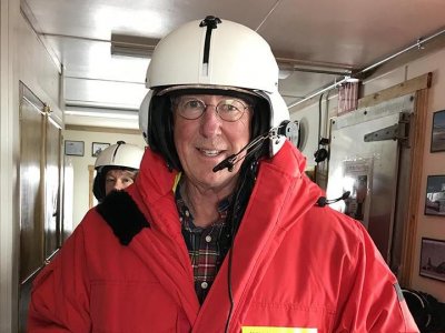William Easterling prepares to board a helicopter in Antarctica to tour research sites out on the continent.
