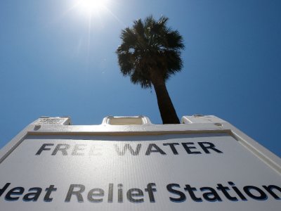Associated Press/Ross D. Franklin A Salvation Army hydration station sign gets hit by the midday sun as temperatures climb to near-record highs, Monday, June 19, 2017, in Phoenix.