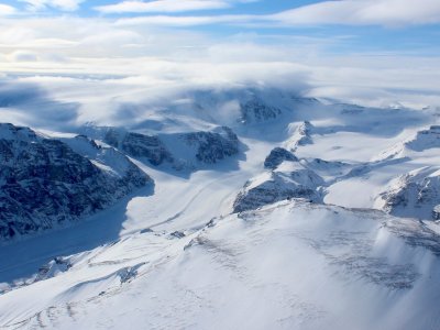 Ice capped and snow-covered mountains of coastal west Greenland.