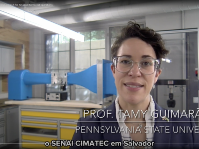 Youtube screenshot of Tamy Guimarães speaking in lab