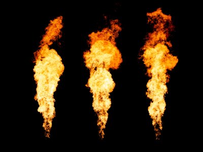 Set of three isolated fire pillars. Flame tongue goes from gas burner