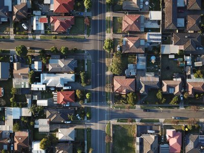 An aerial view of houses lining streets